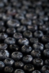 Fresh ripe blueberries pattern dark photo macro