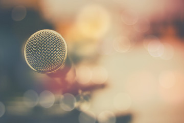 microphone and bokeh background, concept as music instrument in studio room and meeting hall - obrazy, fototapety, plakaty
