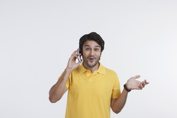 Young man talking on mobile phone