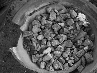 BLACK AND WHITE PHOTO OF CRUSHED STONE OR ANGULAR ROCK