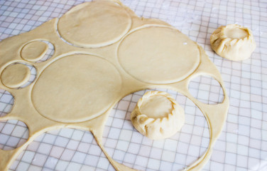 Sculpt russian pies kurniki in kitchen overhead. © Olga