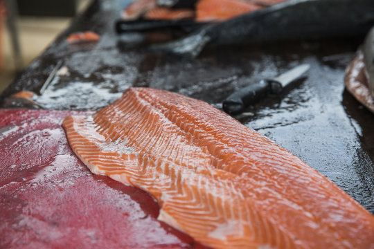 Closeup of fresh salmon fillet on a cutting board