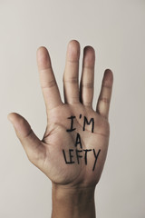 text I am a lefty in the palm of the hand