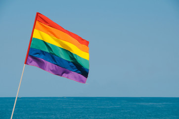 LGBT flag isolated overlooking the ocean