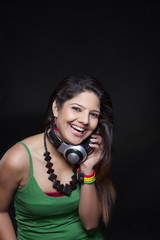 Young woman holding headphones