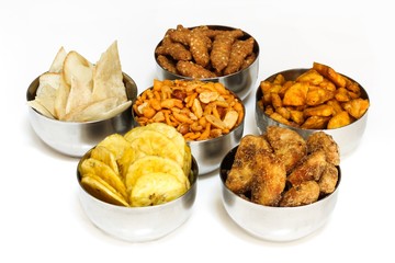 Variety of Indian snacks isolated on white