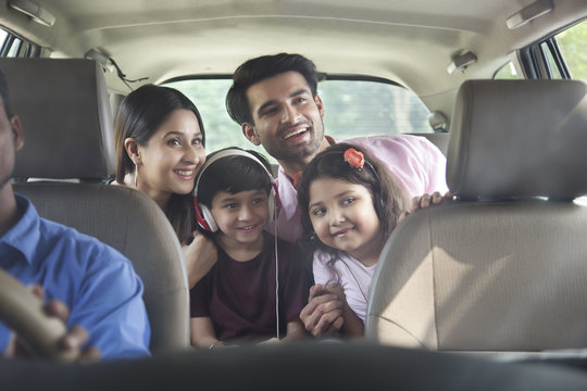 Happy Family In Car For Road Trip	