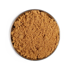 Unrefined light brown cane sugar pile in metal bowl isolated on white background, top view