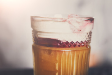 Creative cocktail in night club bar background