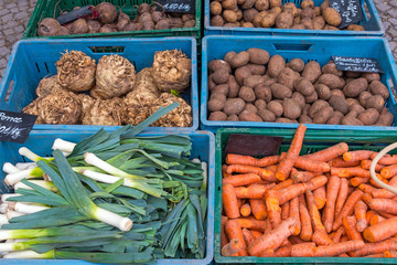 Leek, carrots and potatoes for sale at a market