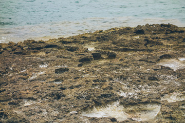 stone cliffs at mallorca with sea in the background
