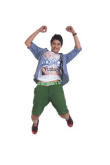 Full length portrait of young man jumping isolated over white background