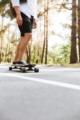 Picture of young man on skateboard outdoors.