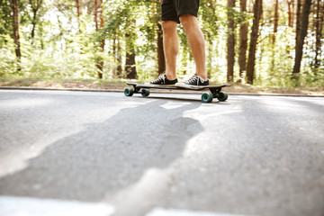 Picture of young man on skateboard outdoors.