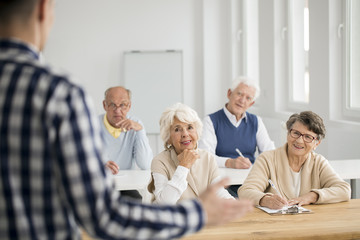 Women and men making notes