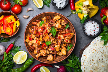 Cooking Mexican taco with meat beans and vegetables.