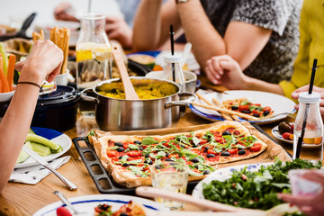 Communal table with fresh pizza
