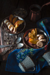 Chocolate mousse with fruits on the wooden table