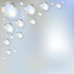 Diamonds in the corner on a blue bokeh background.