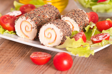 Goat cheese with salad and cherry tomatoes. 