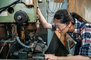 factory woman wearing safety protection glasses