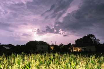 Thunderstorm with lightning on the field