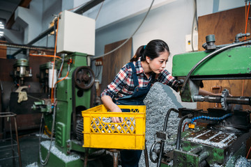 Fototapeta na wymiar milling machine female employee seriously working