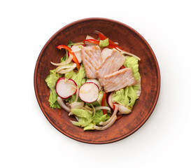 Bowl of original asian salad with salmon and vegetables isolated at white