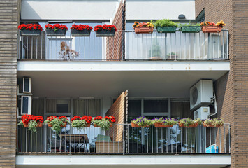 Balconies with summer flowerpots