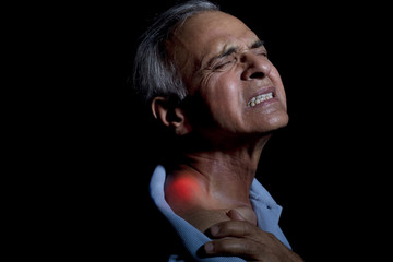 Close-up of an elderly man suffering from shoulder pain 