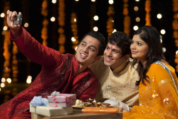 Friends with camera taking a self portrait