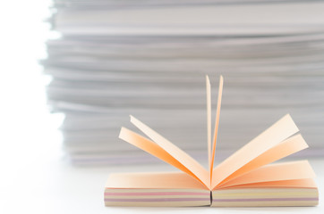 On a white table colorful block for notes