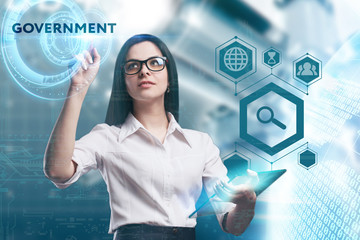 The concept of business, technology, the Internet and the network. A young entrepreneur working on a virtual screen of the future and sees the inscription: Government
