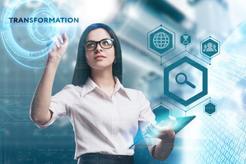 The concept of business, technology, the Internet and the network. A young entrepreneur working on a virtual screen of the future and sees the inscription: Transformation