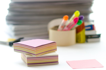 On a white table colorful block for notes
