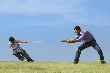 Tug of war between son and father