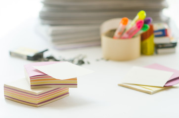 On a white table colorful block for notes