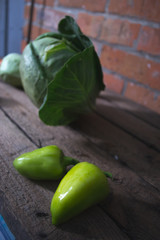 Fresh cabbage heads on a wooden background.