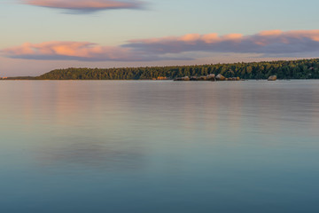 Beautiful Baltic sea landscape with stone breakwater. Tranquil long exposure landscape
