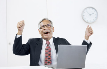 Old businessman rejoicing 
