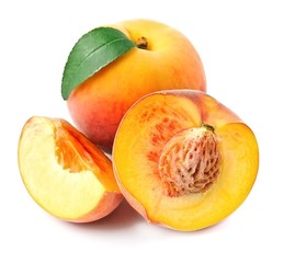 Ripe peaches with leaves .