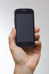 Smartphone in a hand outstretched