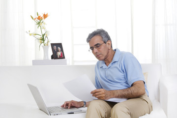 Adult man working on a laptop