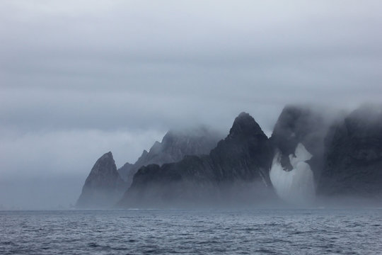 Fototapeta Mountains in fog, Antarctic Peninsula landscape, Antarctica