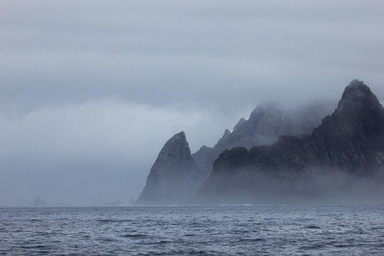 Fototapeta Mountains in fog, Antarctic Peninsula landscape, Antarctica
