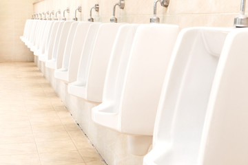 row of outdoor urinals men public toilet