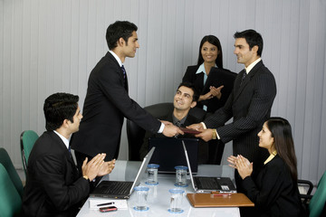 Executive handing a file 