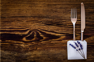 Knife and fork on old wooden table