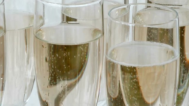 Champagne is bubbling. Glasses with alcohol at the party. Celebration drink at the Banquet.