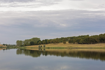 Fototapeta na wymiar Quiet lake with reeds